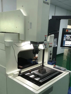 CNC machining process for injection mold components including precision milling of mold cores cavities and inserts in manufacturing workshop