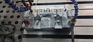 Injection mold manufacturing process showing mold design machining assembly and quality inspection