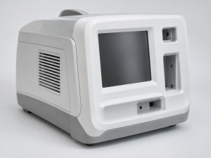 White plastic medical equipment housing with a large display opening, ventilation grille, connector openings, and clean molded exterior surfaces.