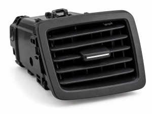 Automotive air vent injection molding plastic component with adjustable louvers and precision molded frame.