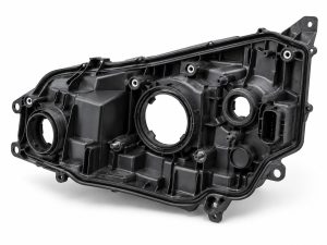 Headlight housing injection molding with sealing edges, mounting bosses and reinforcing ribs
