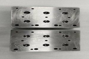 Precision CNC machined mold core and cavity inserts with detailed features and tight tolerances